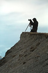 Image showing Photographer with tripod