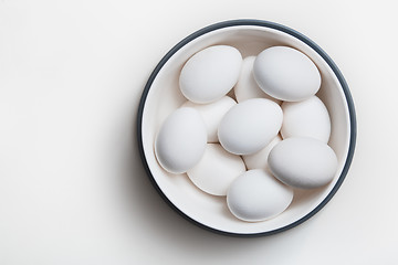 Image showing Hen eggs in a white bowl