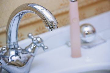 Image showing Chrome water tap and sink