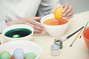 Image showing Woman preparing Easter eggs