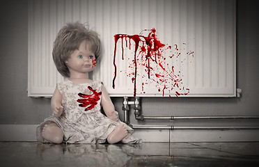 Image showing Concept of child abuse - Bloody doll