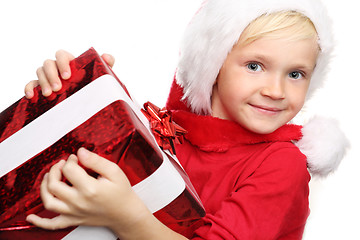 Image showing Happy child in the cap of St. Nicholas of packaged gift 