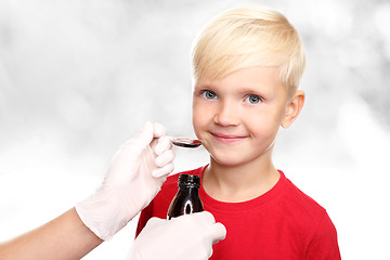 Image showing A child with a doctor, a cure for the flu.