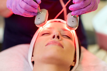 Image showing young woman having face microdermabrasion at spa