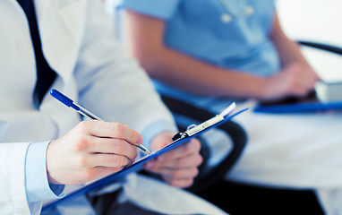 Image showing close up of happy doctors at seminar or hospital