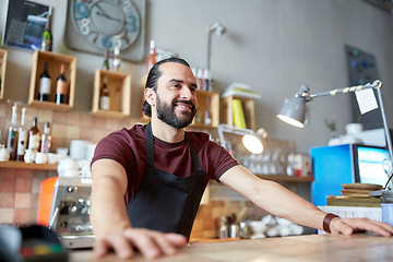 Image showing happy man or waiter at bar or coffee shop