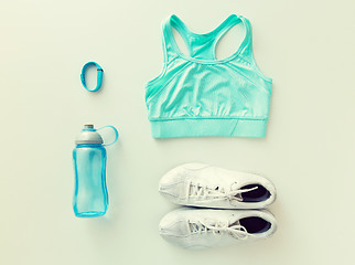 Image showing close up of sportswear, bracelet and bottle