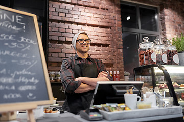 Image showing happy seller man or barman at cafe counter