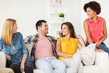 Image showing group of happy friends talking at home