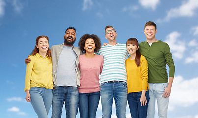 Image showing international group of happy people over blue sky