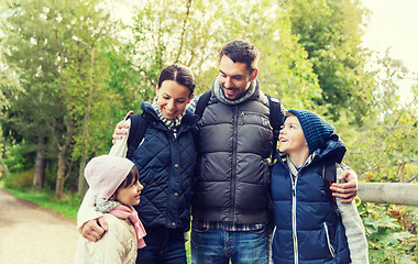 Image showing happy family with backpacks hiking