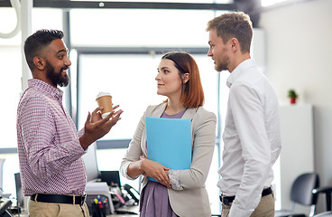 Image showing happy business team drinking coffee at office