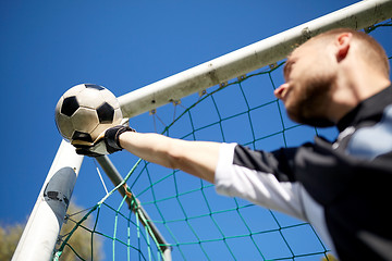 Image showing goalkeeper with ball at football goal on field