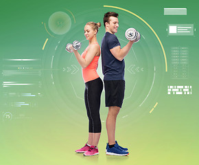 Image showing sportive man and woman with dumbbells