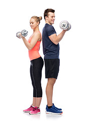 Image showing sportive man and woman with dumbbells