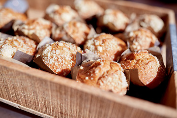 Image showing close up of muffins in wooden box