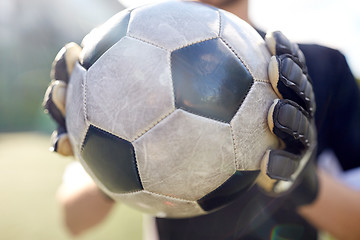 Image showing close up of goalkeeper with ball playing football