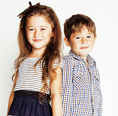 Image showing little cute boy and girl hugging playing on white background, happy family smiling twins