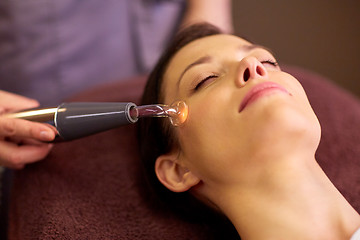 Image showing woman having hydradermie facial treatment in spa