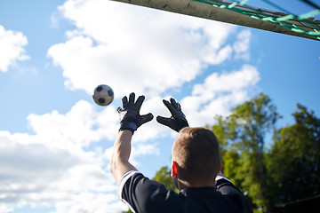 Image showing goalkeeper with ball at football goal on field