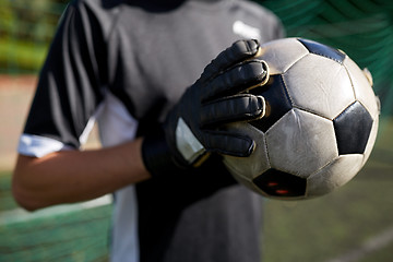 Image showing close up of goalkeeper with ball playing football