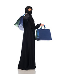 Image showing muslim woman in hijab with shopping bags