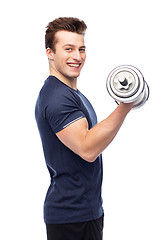 Image showing happy sportive young man with dumbbell