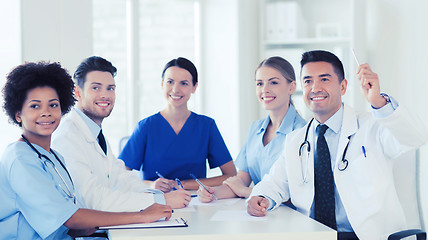 Image showing group of happy doctors on conference at hospital