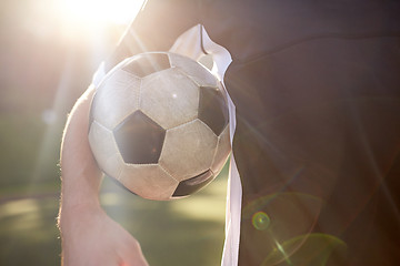 Image showing close up of soccer player with ball on field