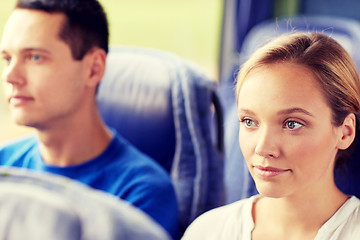 Image showing happy young woman sitting in travel bus or train