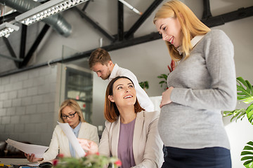 Image showing happy business team with papers in office