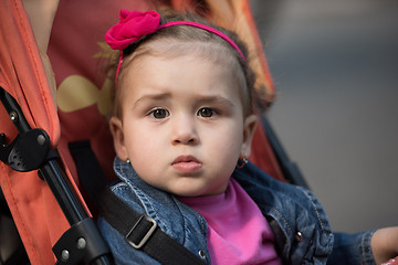 Image showing baby girl sitting in the pram