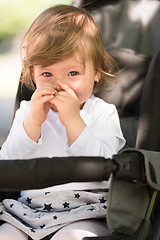 Image showing baby girl sitting in the pram