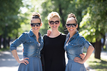 Image showing portrait of three young beautiful woman with sunglasses