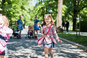 Image showing twins mother with children  in city park