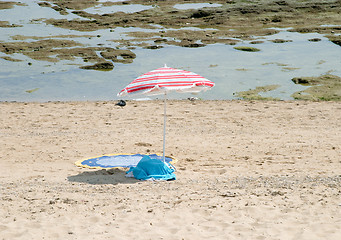 Image showing Beach umbrella and towel in the bay of Cadiz, Andalusia, Spain