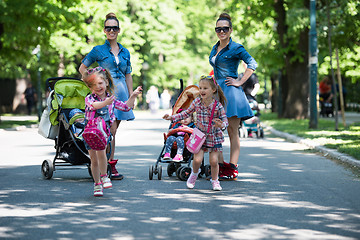 Image showing twins mother with children  in city park