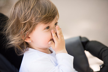 Image showing baby girl sitting in the pram