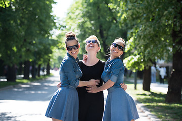 Image showing portrait of three young beautiful woman with sunglasses