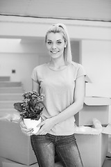 Image showing girl moving in the new apartment