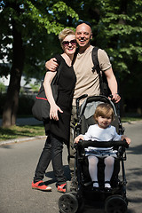 Image showing couple with baby pram in summer park