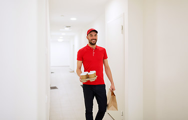 Image showing man delivering coffee and food to customer home