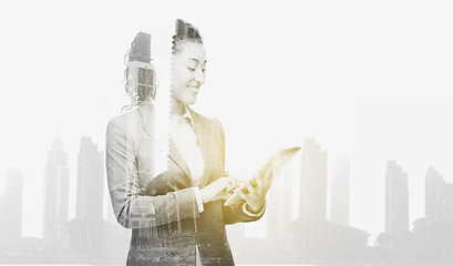 Image showing smiling businesswoman with tablet pc computer