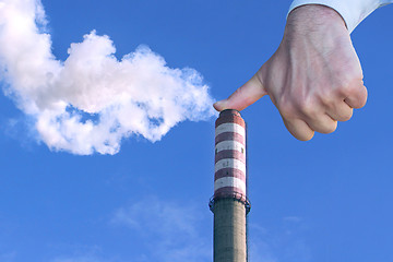 Image showing Man with hand making stop to environmental pollution