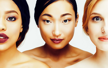 Image showing three different nation woman: asian, african-american, caucasian together isolated on white background happy smiling, diverse type on skin, lifestyle people concept 