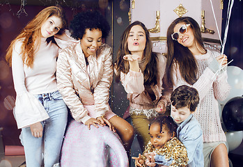 Image showing Lifestyle and people concept: young pretty diversity nations woman with different age children celebrating on birth day party together happy smiling, making selfie. African-american, asian and caucasi