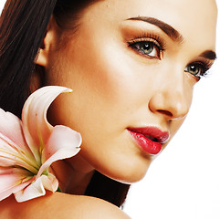 Image showing young attractive lady close up with hands on face isolated flowe