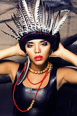 Image showing young pretty woman with make up like red indian, futher in hair,