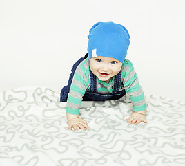 Image showing little cute baby toddler on carpet isolated close up smiling ado