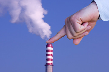 Image showing Man with hand making stop to environmental pollution